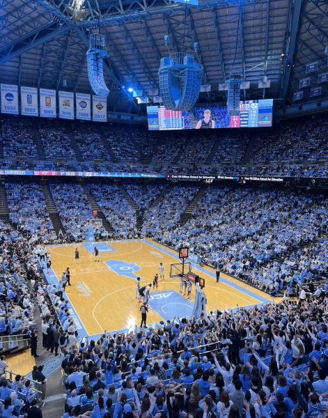 University of North Carolina (UNC) played a basketball game versus Virginia Tech on February, 17, 2024. Fans put their arms up in the air, a tradition at UNC basketball games anytime a free throw is being taken.  